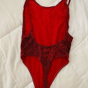 Sexy, body-hugging Tna Bodysuit in XS.